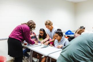 Upward Bound Students and instructor in Sewing Class